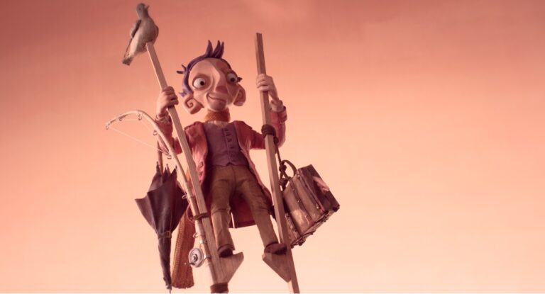 Stop-motion character on stilts with bird, umbrella, and bag. VFF film series image.