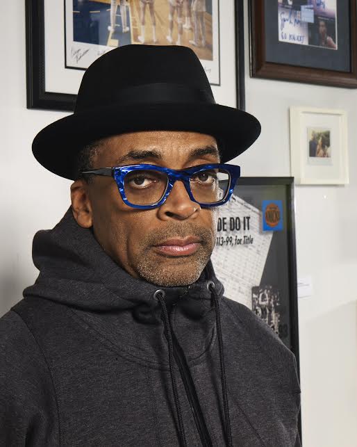Spike Lee at the 2017 Virginia Film Festival, wearing a black hat and blue glasses.