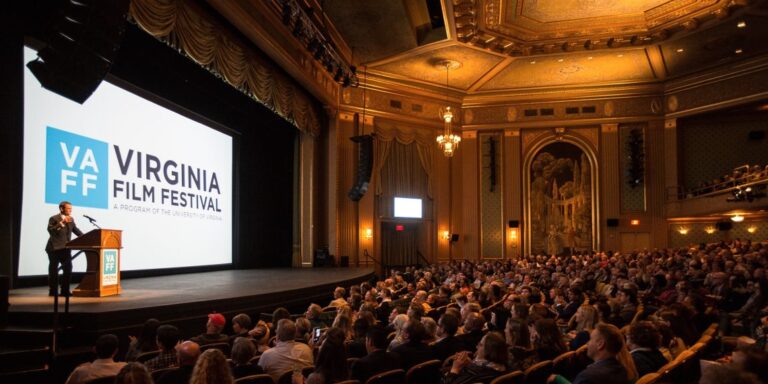 Virginia Film Festival event: speaker on stage, large audience.