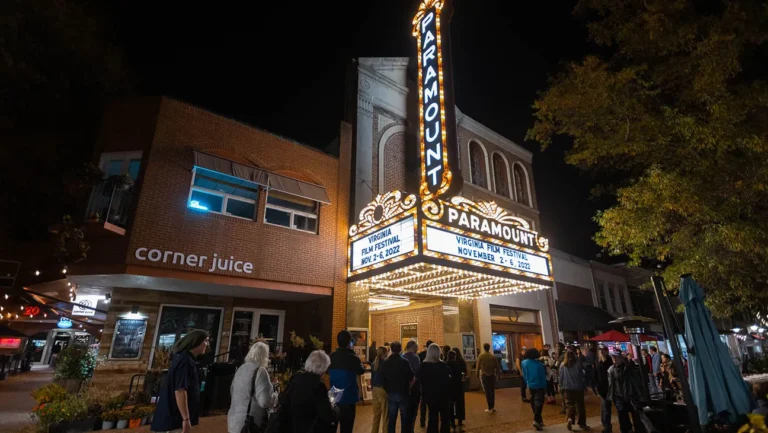 Paramount Theater at night for the Virginia Film Festival, Nov 2-6, 2022. "Corner Juice" storefront is visible.