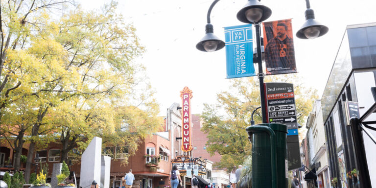 Downtown Charlottesville street view with Paramount Theater and Virginia Film Festival banners.