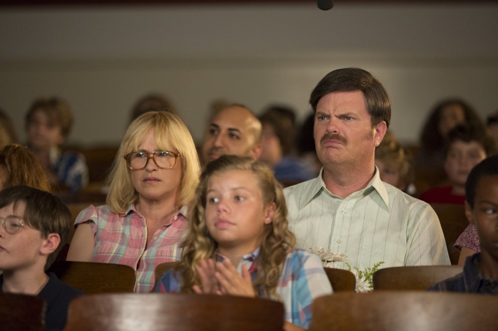 Rainn Wilson in "Permanent" movie, sitting with family.