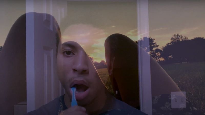 Man brushing teeth, overlaid with a sunset scene.
