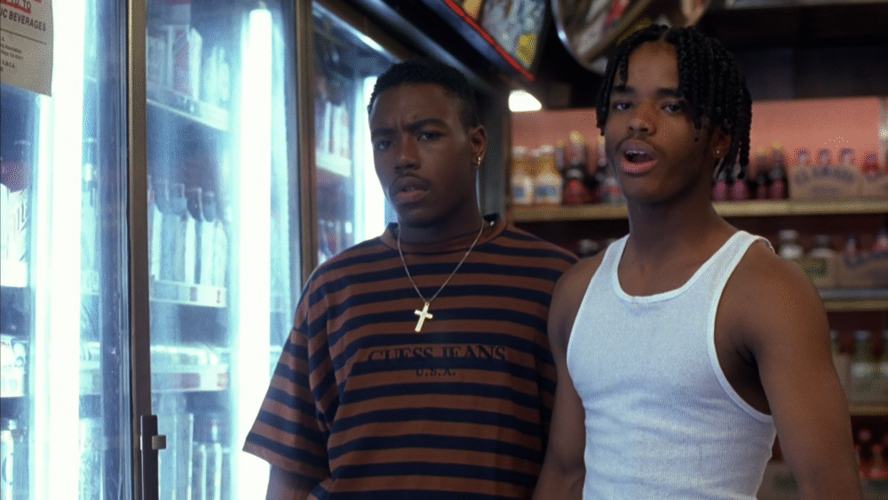 Scene from Menace II Society with two young Black men in a store.