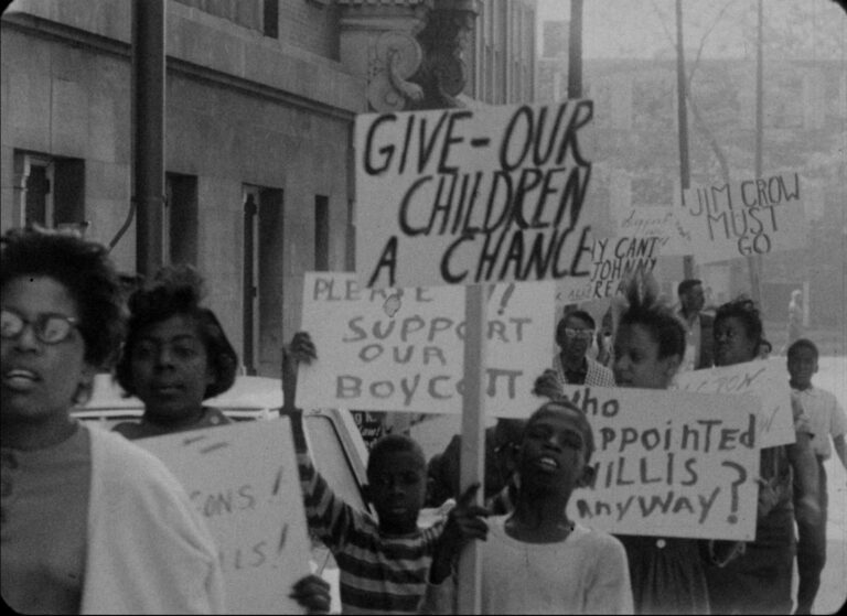1963 boycott protest: Children holding signs reading "Give our children a chance" and "Jim Crow must go.
