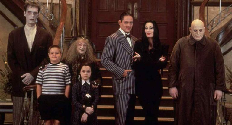 The Addams Family cast photo: Gomez, Morticia, Wednesday, Pugsley, Fester, Grandmama, and Lurch.