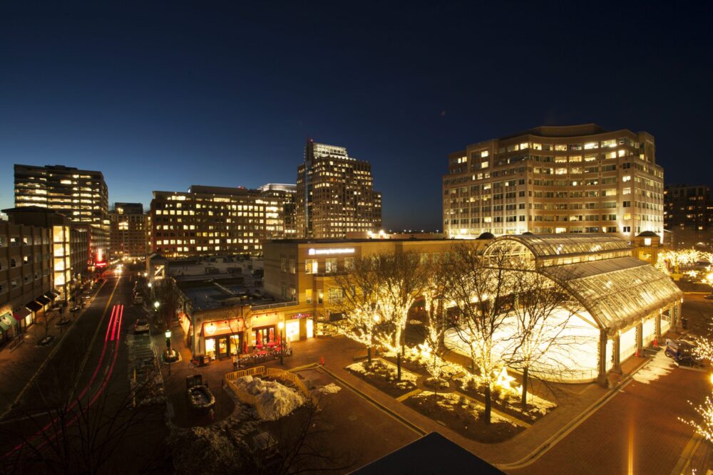 Reston, Virginia at night, showcasing lit buildings and streets. Another Way of Living in Reston, VA.