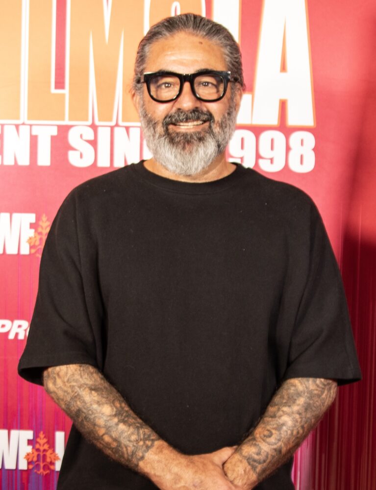 Anthony Pedone poses with a beard and glasses.