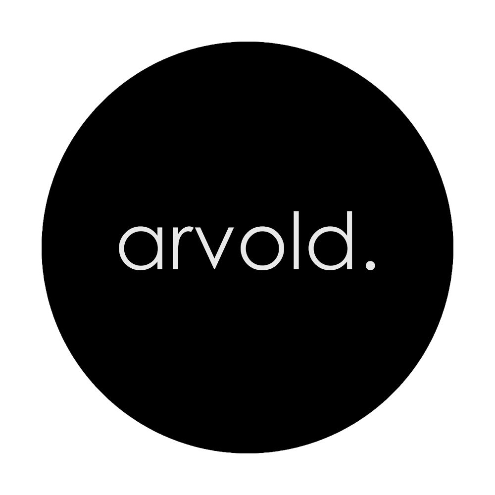 Black circle logo with the word "arvold." in white. Branding for arvold casting.