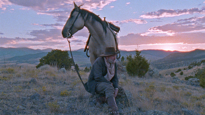 Lefty Brown with his horse at sunset, a scene from The Ballad of Lefty Brown.