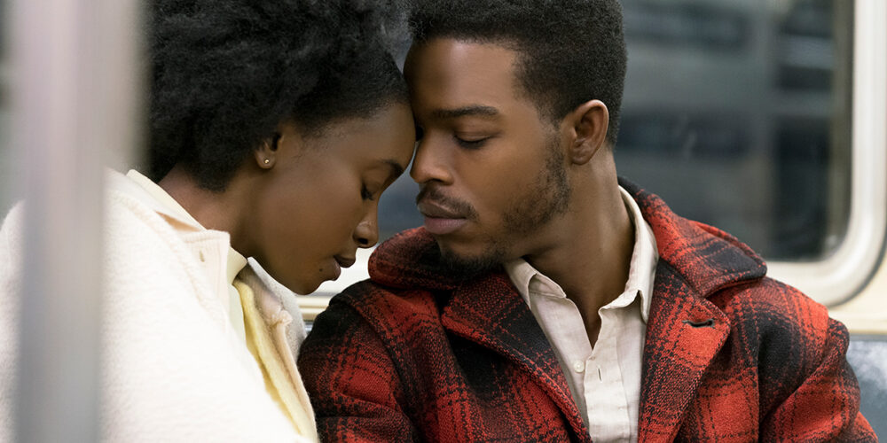 Couple embracing on a train in "If Beale Street Could Talk"