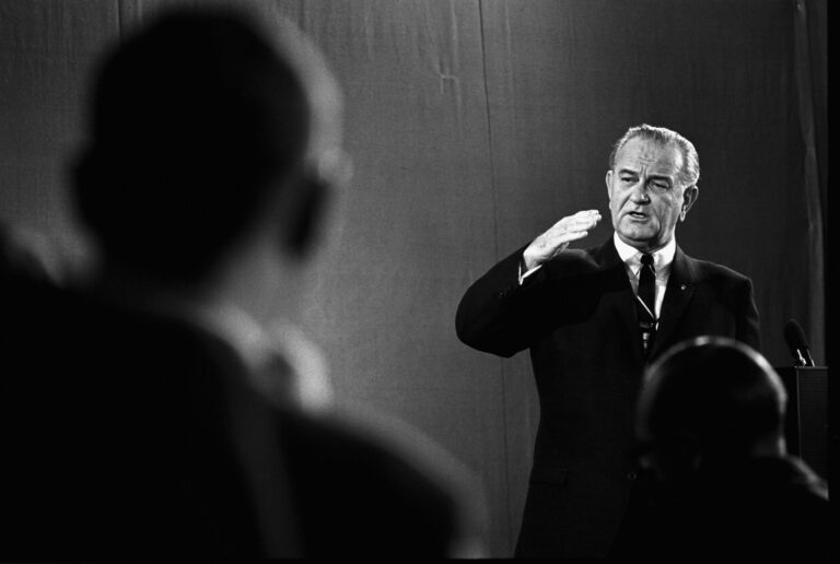 Lyndon B. Johnson giving a speech during the 1964 campaign, as discussed in "Bombs Away"
