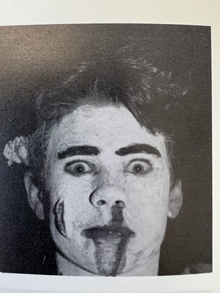 Burton Gray in costume with white face paint and dramatic makeup.