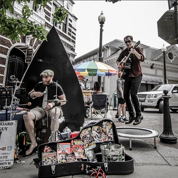 Street performers: drummer, guitarist jumping on trampoline for "Buskin' Blues