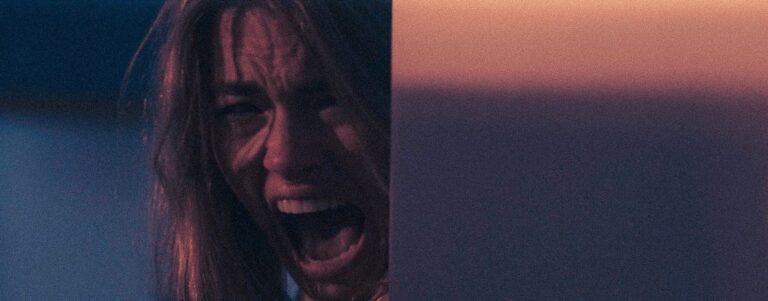 Woman screaming in terror, possibly related to the "Catch a Killer" blog.