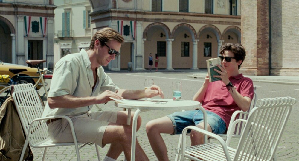 Armie Hammer and Timothée Chalamet in Call Me by Your Name at a cafe.