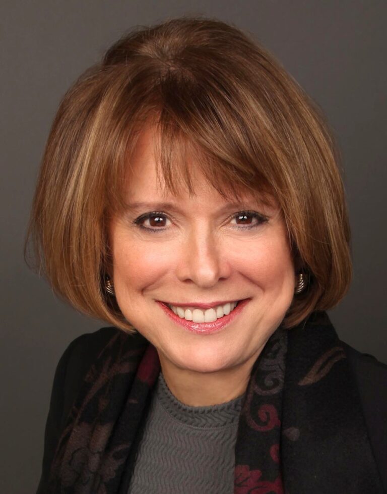 Christy Carpenter smiling in a professional headshot.