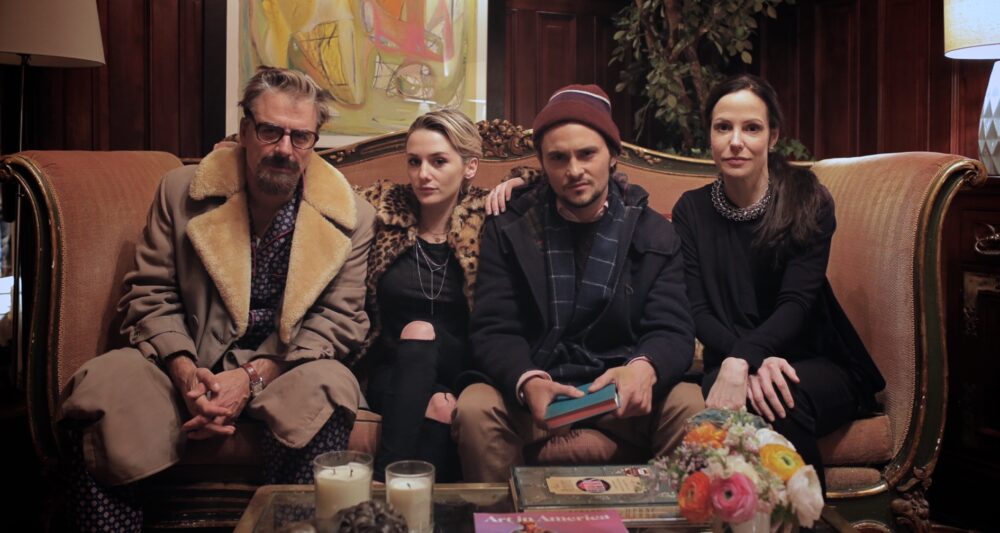 Cast of Chronically Metropolitan sitting on a couch
