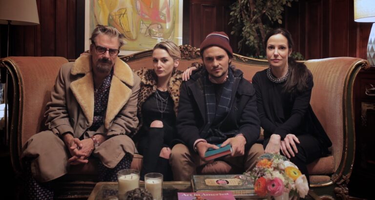 Cast of Chronically Metropolitan sitting on a couch