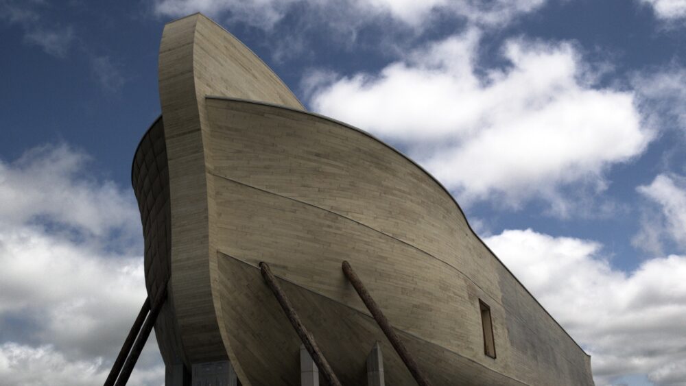 The Ark Encounter's massive wooden Noah's Ark under a cloudy sky.