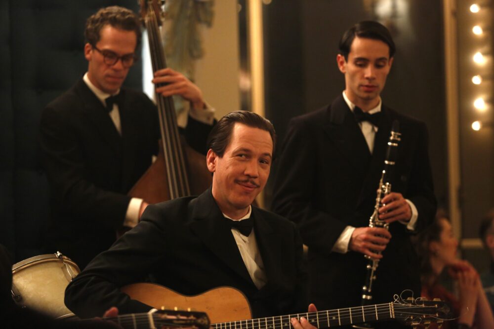 Django Reinhardt and his band perform in Django film scene.