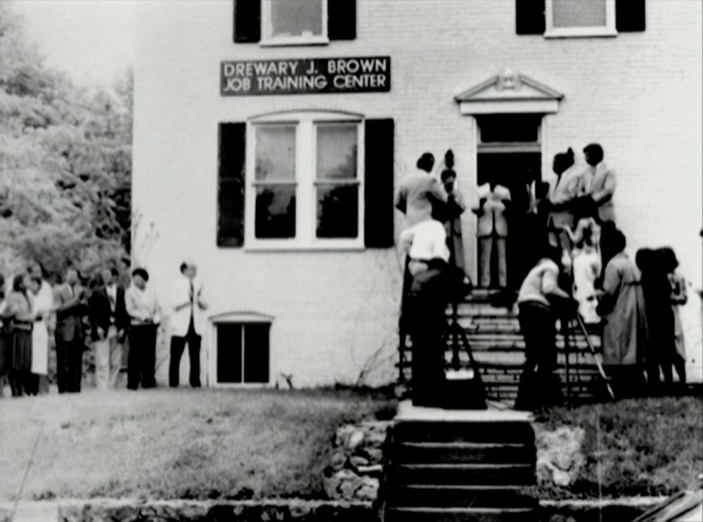 Drewary J. Brown Job Training Center with people gathered outside for an event.
