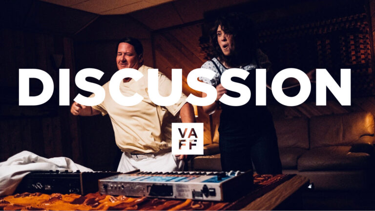 Discussion graphic for Electric Jesus featuring two people and a keyboard. Text: "DISCUSSION" and "VAFF".