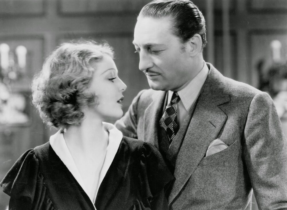 Adolphe Menjou and Loretta Young in "Employees' Entrance" film still.