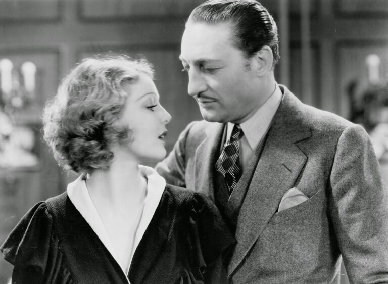 Adolphe Menjou and Loretta Young in "Employees' Entrance" film still.