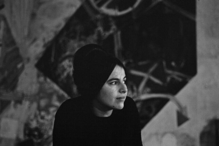 Eva Hesse portrait. Black and white photo of the artist looking to the side.
