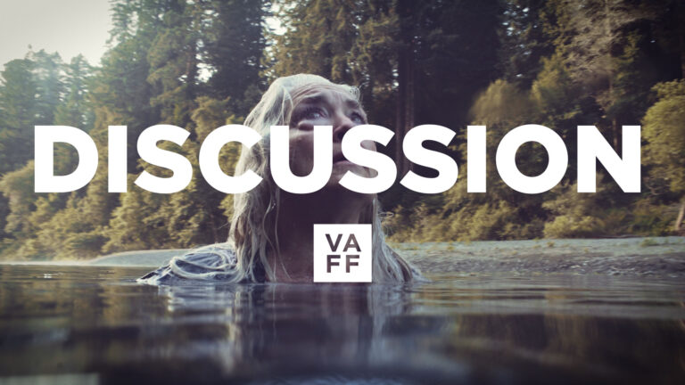 Discussion at VAFF with a woman emerging from water, trees in background.