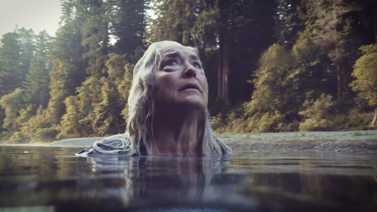 Woman in water, gazing upwards in Freeland.