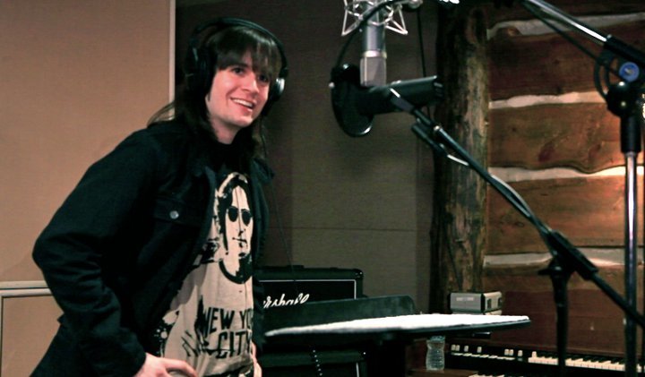 Musician with headphones in recording studio, "New York City