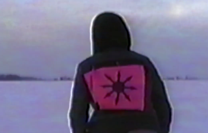 Girl in hood with sunburst design on pink fabric, winter landscape