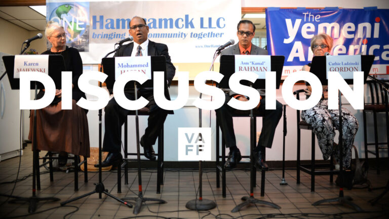 Hamtramck, USA discussion panel featuring four speakers at a community event.