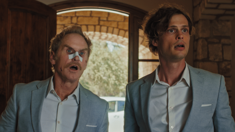 Surprised men in suits, one with a bandage on his nose