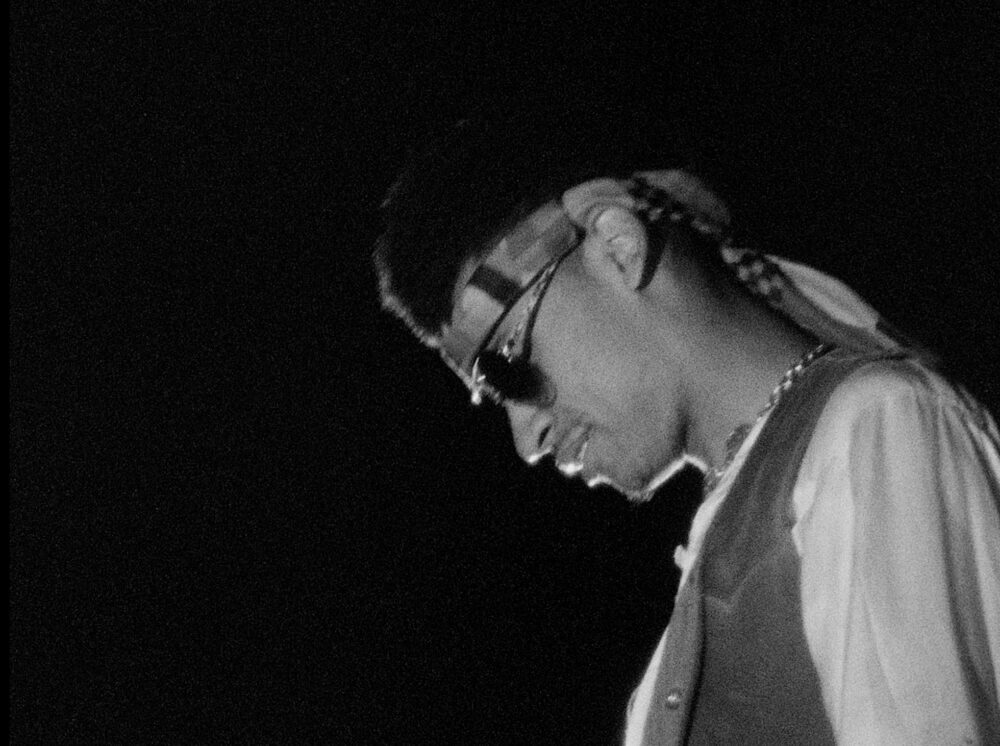 Man in sunglasses and headband, possibly related to the blog "How Can I Ever Be Late.