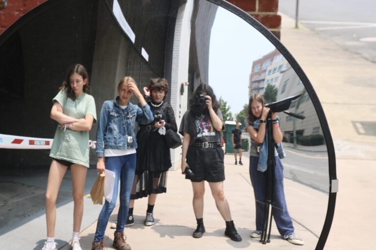 Light House Studio Shorts: Five young people reflected in a convex mirror.