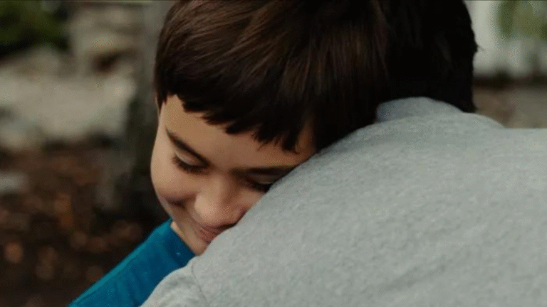 Boy embraces father in a touching moment from short film