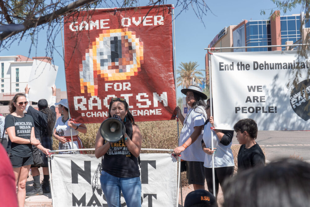 Protest against Native American mascoting: "Game Over for Racism,"