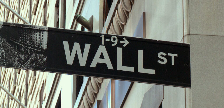 Wall Street street sign in New York City, directing to 1-9 Wall St.