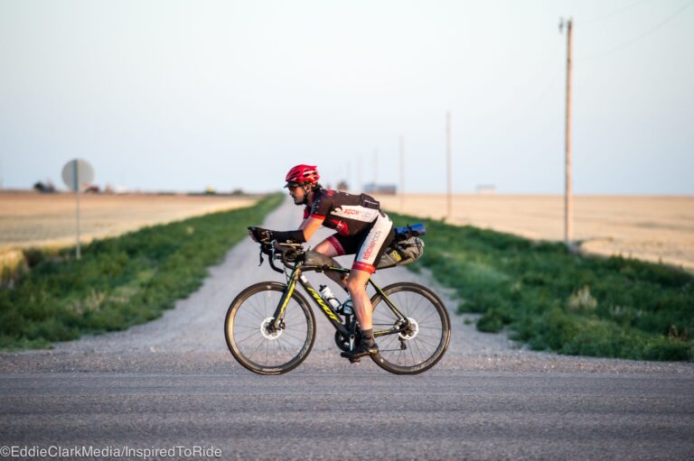 Cyclist bikepacking on a rural road.