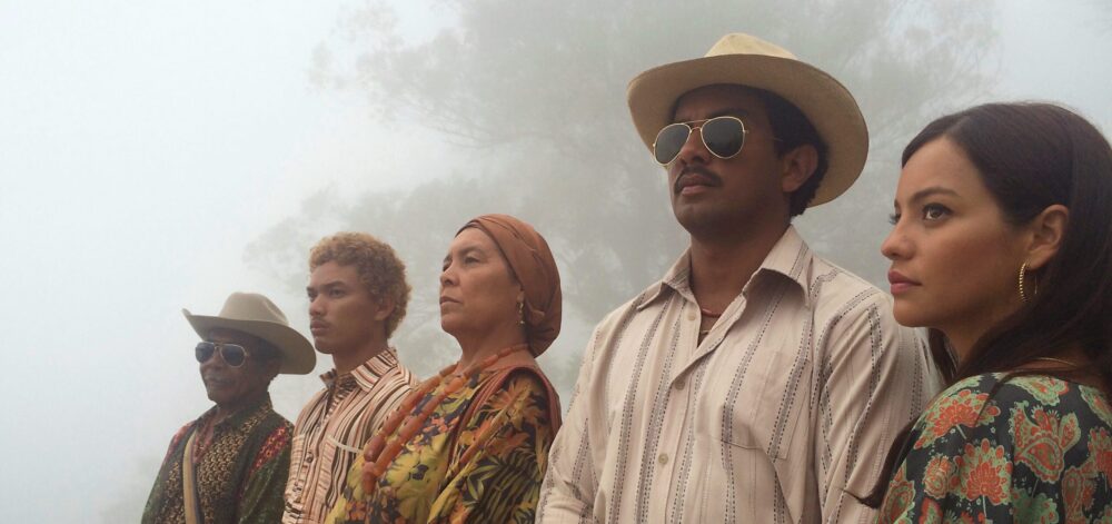 Birds of Passage film still: Indigenous family in traditional attire stands together in fog.