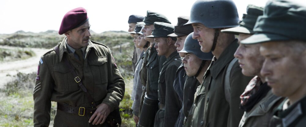 British officer in "Land of Mine" overseeing German POWs.