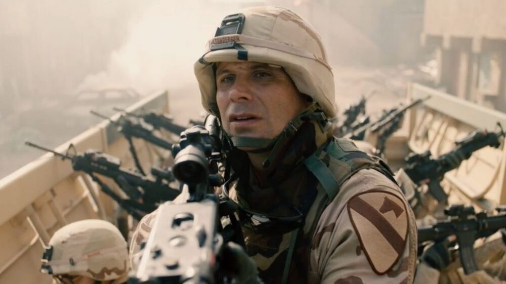 Scene from "The Long Road Home" featuring a soldier in combat gear.