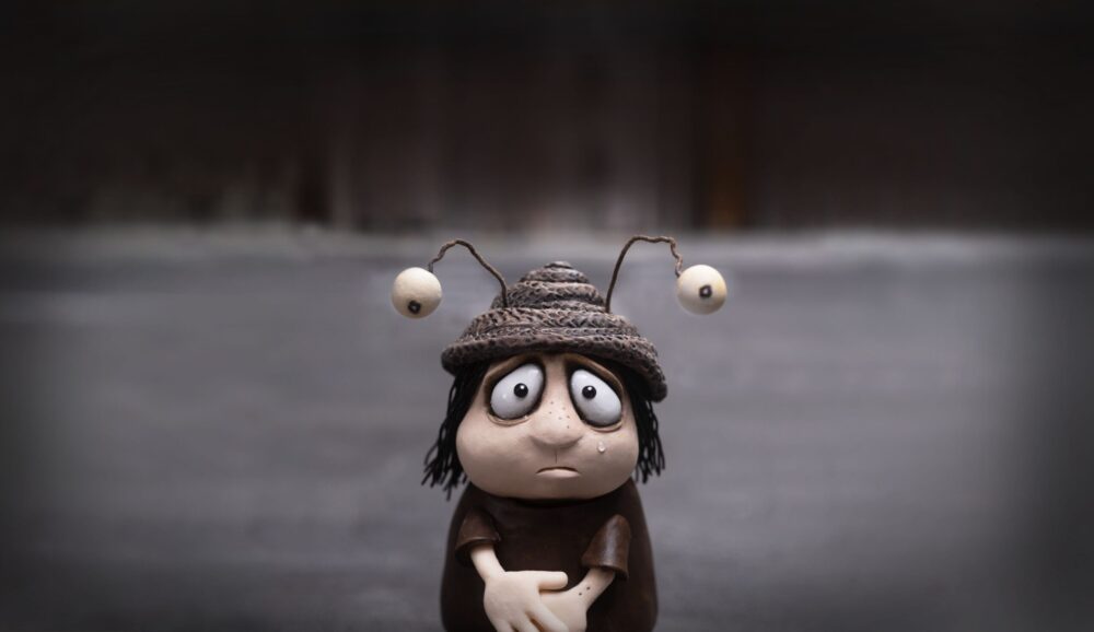 Sad snail character with large eyes and a tear, from "Memoir of a Snail.