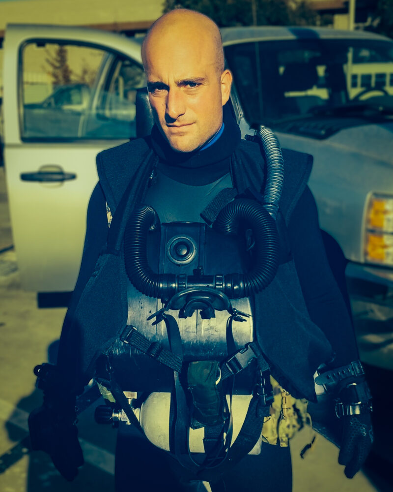 Matt Paul in a diving suit, ready for underwater exploration.