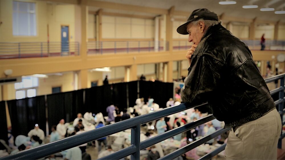 Stan Brock looks over Remote Area Medical clinic attendees.