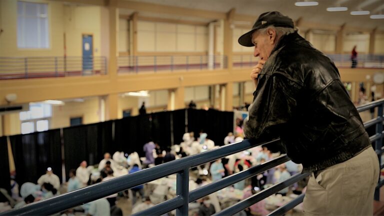 Stan Brock looks over Remote Area Medical clinic attendees.