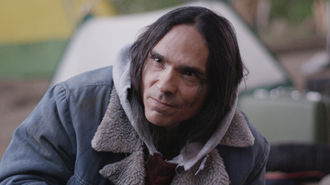Mekko character, actor Rod Rondeaux, wearing a jacket and hoodie, looking at the camera.